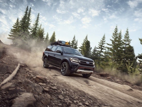 2024 Ford Expedition driving down a dirt road