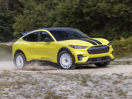 2024 Ford Mustang Mach-E driving fast on a dirt road